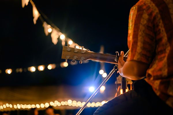 acoustic guitar player on stage